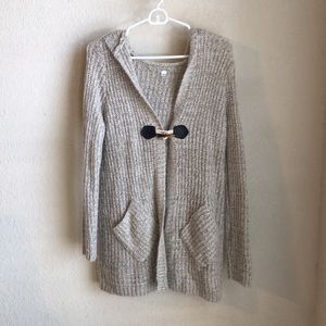 Long peppered hooded knitted sweater with pockets